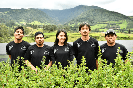 Treeapp planting team standing with seedlings before reforestation work to support ecosystem restoration and biodiversity in Ecuador.